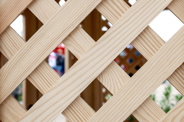 Old wooden lattice background. Partition wooden texture. Wooden arbor pavilion with lattice