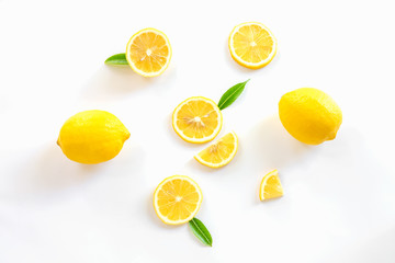 Ripe lemon and slices with leaves isolated on white background,Flat lay.