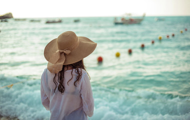 A happy young girl and a Mediterranean sea