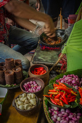 The seller is making special sambal for traditional fried tofu	