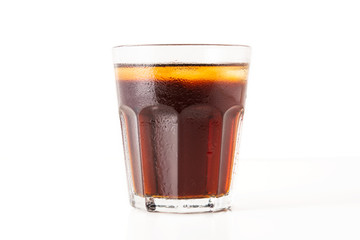 misted glass with soda on a white background
