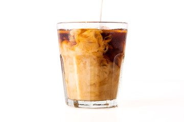 ice coffee with cream poured over on white background