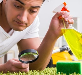 Young husband man cleaning floor at home