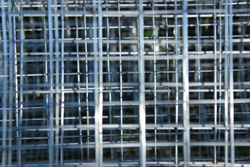 Cropped shot of metal grid. Abstract metal background texture. 