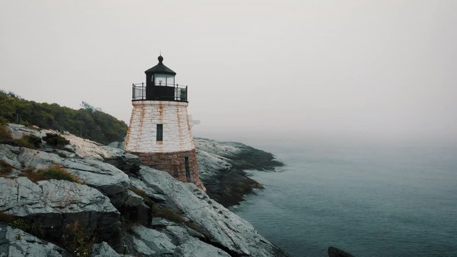 aerial drone lighthouse rocky sea coast rotate