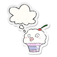cartoon cupcake and thought bubble as a distressed worn sticker