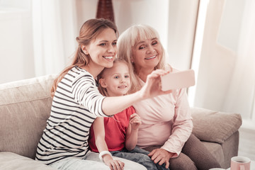 Wonderful family making selfie for social media