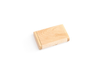 A small wooden box lies isolated on a white background. The view from the top.