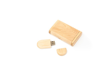 Opened USB flash drive in a wooden case next to a gift wooden box. Isolated on white background.