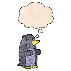 cartoon penguin and thought bubble in grunge texture pattern style