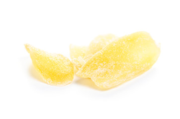 Fototapeta na wymiar Ginger candied fruit, dried ginger with sugar on a white background, top view