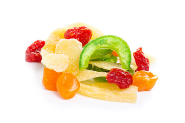 Pile candied dried tropical fruits on the white background isolation