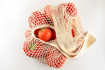Grocery canvas tote string shopping bag with food. Vegetables in natural bag, eco friendly,flat lay.Sustainable lifestyle concept,zero waste food shopping. Plastic free, reuse, reduce, recycle, refuse