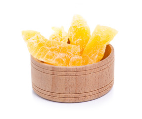 Candied dry melon with sugar in wooden bowl on white background isolation