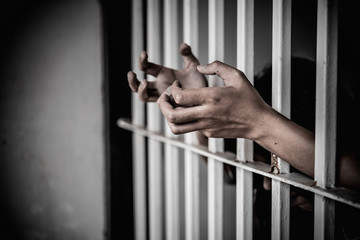 Hands of women desperate to catch the iron prison,prisoner concept,thailand people,Hope to be...