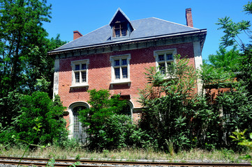 Abandoned train station with old red brick architecture