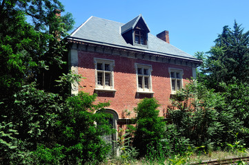 Abandoned train station with old red brick architecture