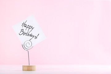 Paper with text Happy Birthday on pink background