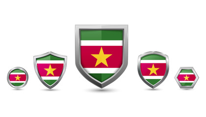 Set of suriname country flag with metal shape shield badge