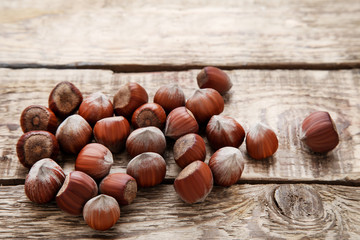 Ripe hazelnuts on brown wooden table