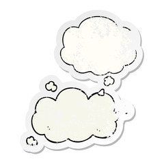 cartoon cloud and thought bubble as a distressed worn sticker