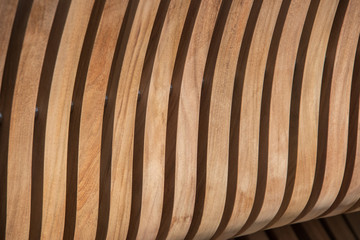 Vertical curved light colored wooden slat background