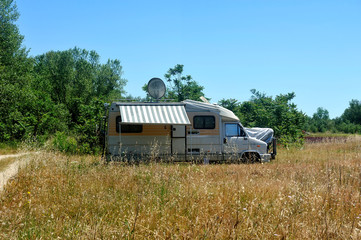Camping car installed in the middle of the fields
