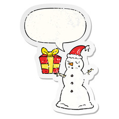 cartoon snowman and present and speech bubble distressed sticker