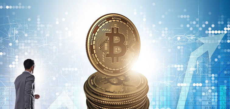 Businessman walking towards bitcoins in cryptocurrency blockchai