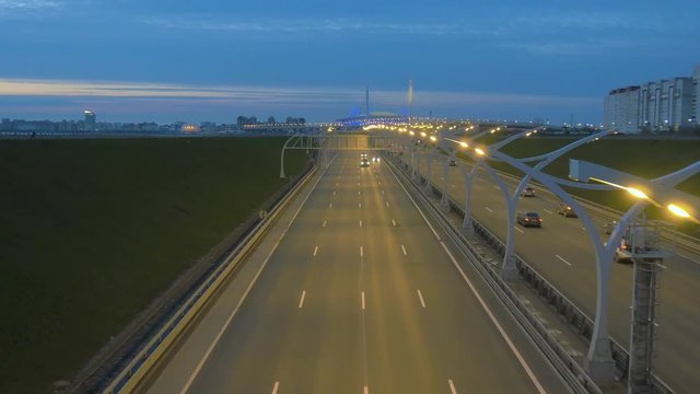 Night highway road in Saint Petersburg. Road in Russia. Colorful car and traffic lights.