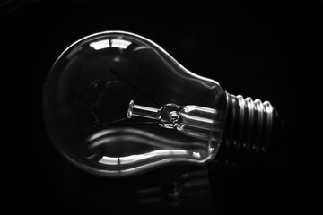Silhouette of a light bulb in black and white