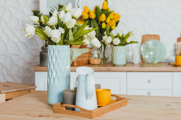 Kitchen utensils, concept of home decor kitchen decorated with flowers, front view