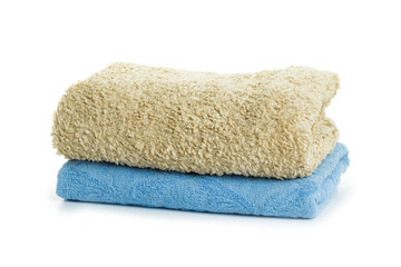 Fototapeta na wymiar Stack of clean coloful soft towels on white background