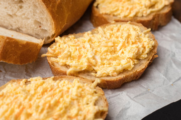 Sandwiches from fresh bread. Grated cheese bruschetta. Cooking. Close up