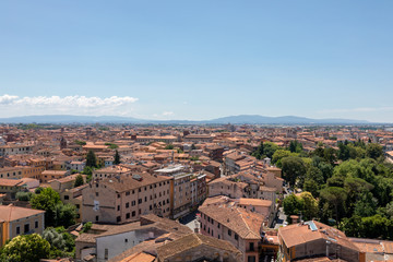Obraz premium Panoramic view of Pisa city with historic buildings and far away mountains