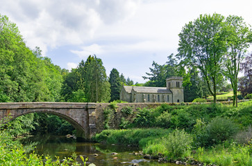 Fototapeta na wymiar Askham Bridge and St Peter's Church, Askham, Cumbria, England