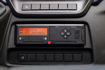 Digital tachograph display reads Vehicle UTC Correct. No personal data. Tachograph in a van