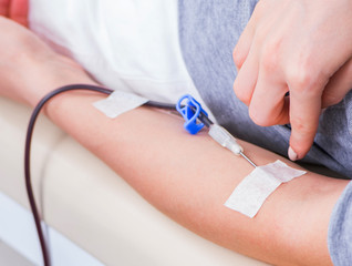 Patient getting blood transfusion in hospital clinic