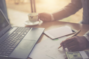Money accountants are calculating income and analyzing marketing plans.