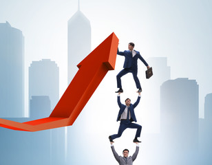 Businessman supporting growtn in economy on chart graph