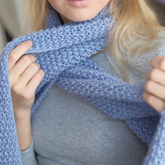 Portrait shoot of beautiful young girl posing in cold weather winter handmade knitting clothes