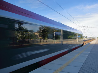 train in motion leaving  station