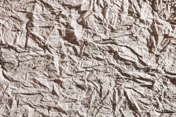 Gray paper background, like concrete, backdrop wrinkled creased and empty isolated background 