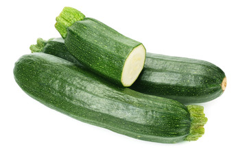 fresh green zucchini with slices isolated on white background.