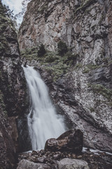 Obraz premium Closeup view of waterfall scenes in mountains, national park Dombay, Caucasus