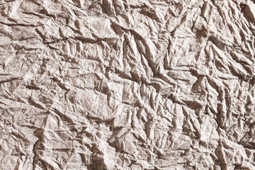 Gray paper background, like concrete, backdrop wrinkled creased and empty isolated background 