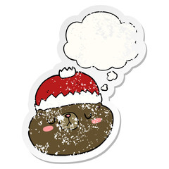 cartoon christmas bear and thought bubble as a distressed worn sticker