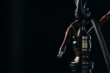 black hookah stem and hose on black with copy space