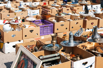 Boxes with second hand objects on flea market in Berlin