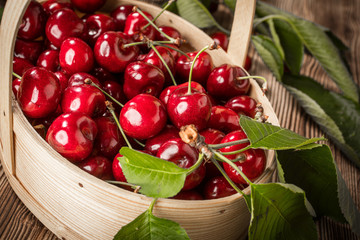 Sweet cherries in a wooden basket.